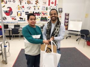 Youth and Teacher holding bag